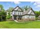 Attractive two-story home with a well-kept lawn and welcoming front porch at 16244 Perrault Ct, Fishers, IN 46040