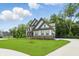 Spacious two-story house with a lush green lawn and long driveway at 16244 Perrault Ct, Fishers, IN 46040