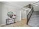 Stylish foyer with a staircase, decorative table, and modern decor at 16244 Perrault Ct, Fishers, IN 46040