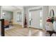 Bright foyer with wood floors, elegant decor, and ample natural light at 16244 Perrault Ct, Fishers, IN 46040