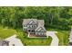 Beautiful two-story home with well-maintained lawn, landscaping, and hardscaped driveway at 16244 Perrault Ct, Fishers, IN 46040