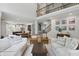 Inviting living room with open layout to kitchen, dining, and staircase featuring high ceilings at 16244 Perrault Ct, Fishers, IN 46040