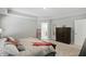 Inviting main bedroom featuring a dark wood bed, soft neutral colors, and bright natural light at 16244 Perrault Ct, Fishers, IN 46040