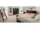 Well-lit main bedroom with a wooden bed frame, dresser, and cozy decor at 16244 Perrault Ct, Fishers, IN 46040