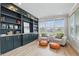 Cozy sitting room with custom shelving and ample natural light at 16244 Perrault Ct, Fishers, IN 46040