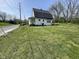 Charming two-story home on a corner lot with a well-maintained lawn and mature trees, ready for your personal touch at 1630 E 18Th St, Indianapolis, IN 46218