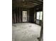 This interior space shows a room with exposed framing and windows at 1630 E 18Th St, Indianapolis, IN 46218