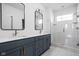Modern bathroom features double vanities, quartz countertop and an elegant glass shower at 1655 Fernley Dr, Westfield, IN 46074
