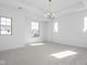 Bright and airy bedroom with plush carpet, large windows, and modern lighting at 1655 Fernley Dr, Westfield, IN 46074
