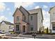Charming home with brick and siding, lush landscaping, and convenient mailbox at 1655 Fernley Dr, Westfield, IN 46074