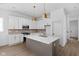 Modern kitchen features white cabinets, marble countertops, and a stylish island at 1655 Fernley Dr, Westfield, IN 46074