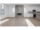 Bright living room featuring a modern fireplace and a seamless flow into the kitchen at 1655 Fernley Dr, Westfield, IN 46074