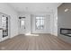 Bright and airy living room with hardwood floors, fireplace and beautiful window views at 1655 Fernley Dr, Westfield, IN 46074