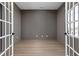 Empty office with hardwood floors and French doors, creating a bright and inviting workspace at 1655 Fernley Dr, Westfield, IN 46074