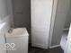 Bathroom showing a vanity sink, toilet, and access to the shower/tub area at 1720 E Cornell Ave, Muncie, IN 47303