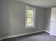 Neutral bedroom featuring a window offering exterior views and ample natural light at 1720 E Cornell Ave, Muncie, IN 47303