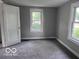 Bedroom featuring neutral walls, and carpet, along with a window for natural light at 1720 E Cornell Ave, Muncie, IN 47303