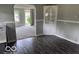 Dining room features wood-look floors, neutral paint, white trim and lots of natural light at 1720 E Cornell Ave, Muncie, IN 47303