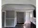 An interior home view showcasing an archway and gray walls at 1720 E Cornell Ave, Muncie, IN 47303