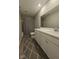 Modern bathroom with white cabinets, a large mirror, and a shower with gray accents at 17255 Seaboard Pl, Noblesville, IN 46060