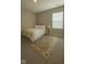 Inviting bedroom with a plush rug, a comfortable bed, and a sunny window view at 17255 Seaboard Pl, Noblesville, IN 46060
