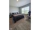 Contemporary bedroom featuring a desk, accent chair, and natural light, perfect for relaxation at 17255 Seaboard Pl, Noblesville, IN 46060