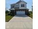 Charming two-story home featuring a brick facade and a well-manicured lawn at 17255 Seaboard Pl, Noblesville, IN 46060
