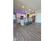 Stylish kitchen features an island with seating and modern stainless steel appliances at 17255 Seaboard Pl, Noblesville, IN 46060