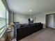 Comfortable living room featuring a large sectional couch and natural light at 17255 Seaboard Pl, Noblesville, IN 46060
