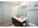 Bathroom featuring a double sink vanity, two mirrors, and neutral decor at 18297 Rickety Dr, Westfield, IN 46074