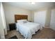 Inviting bedroom featuring a wooden headboard, neutral walls, and a double door closet at 18297 Rickety Dr, Westfield, IN 46074