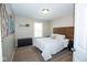 Comfortable bedroom with a wooden headboard, neutral walls, and a large window at 18297 Rickety Dr, Westfield, IN 46074
