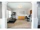 Bright office space featuring large windows, a treadmill, desk, and neutral decor at 18297 Rickety Dr, Westfield, IN 46074