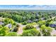 Aerial view of a home in a lush, green community with many trees at 1898 Corniche Dr, Zionsville, IN 46077
