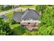 Backyard with a deck and lush landscaping. The deck has a dining set and faces a well maintained yard at 1898 Corniche Dr, Zionsville, IN 46077