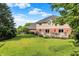 Green backyard showing well-kept lawn, flowerbeds and partial home view at 1898 Corniche Dr, Zionsville, IN 46077
