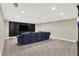 Spacious basement area with plush carpeting and a large TV screen at 1898 Corniche Dr, Zionsville, IN 46077
