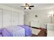 Bright bedroom featuring hardwood floors, double closets, and a ceiling fan at 1898 Corniche Dr, Zionsville, IN 46077