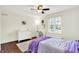 Bright bedroom with hardwood floors, ceiling fan and a window providing ample natural light at 1898 Corniche Dr, Zionsville, IN 46077
