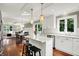 Bright kitchen with white cabinets, an island with seating, stainless steel appliances, and an open layout at 1898 Corniche Dr, Zionsville, IN 46077