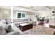 Inviting living room featuring a comfortable sectional sofa and a view of the kitchen at 1898 Corniche Dr, Zionsville, IN 46077