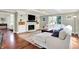 Comfortable living room featuring a white brick fireplace and built-in shelving at 1898 Corniche Dr, Zionsville, IN 46077