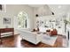 Bright living room features hardwood floors, fireplace, and custom built-in shelving at 1898 Corniche Dr, Zionsville, IN 46077