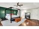 Stylish main bedroom featuring a four-poster bed, hardwood floors, and en-suite bathroom entrance at 1898 Corniche Dr, Zionsville, IN 46077