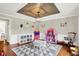 Bright ' room features hardwood floors, neutral walls, unique ceiling details, and ample space for play and storage at 1898 Corniche Dr, Zionsville, IN 46077