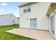 Home's back exterior features a patio and ample green space, great for outdoor entertaining at 1903 Windy Hill Ln, Indianapolis, IN 46239