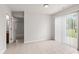 Open dining area features neutral paint and sliding glass door at 1903 Windy Hill Ln, Indianapolis, IN 46239
