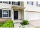 Up close view of the front door and garage on this two-story house at 1903 Windy Hill Ln, Indianapolis, IN 46239