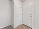 Hallway features two white interior doors and neutral paint at 1903 Windy Hill Ln, Indianapolis, IN 46239