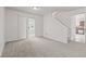 Spacious living room featuring plush carpet and sliding doors at 1903 Windy Hill Ln, Indianapolis, IN 46239